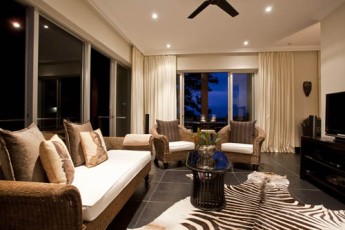 Villa Umdoni Lounge With Cane Furniture And A Zebra Rug